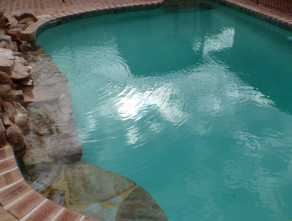 Pool coating by Rainbow Quartz with a tropicana lining